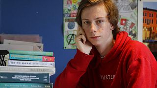 A-Level student and would be medical student Chris Byrne, who is disappointed with his teacher predicted exam results, poses for a photo at home in London, Wednesday, Aug. 19.