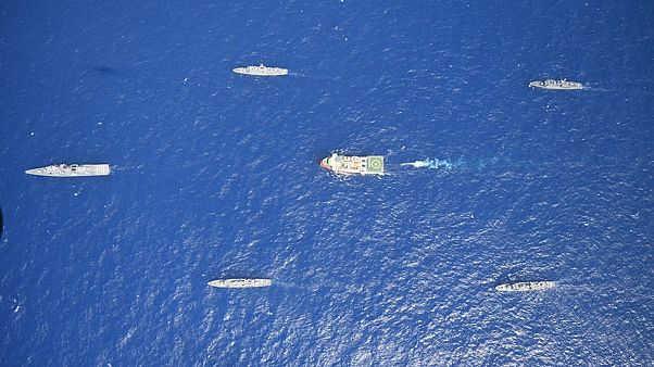 Turkey's research vessel, Oruc Reis, in red and white, is surrounded by Turkish navy vessels as it was heading in the west of Antalya on the Mediterranean Turkey's research vessel, Oruc Reis, in red and white, is surrounded by Turkish navy vessels as it was heading in the west of Antalya on the Mediterranean