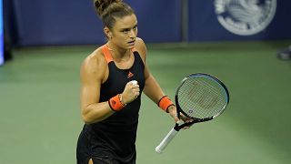 Maria Sakkari, of Greece, reacts to a shot to Serena Williams