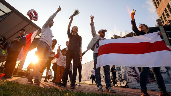 Protesters in Minsk on August 21 after Belarus' authorities detained a leader of striking factory workers and threatened protesters with criminal charges Protesters in Minsk on August 21 after Belarus' authorities detained a leader of striking factory workers and threatened protesters with criminal charges