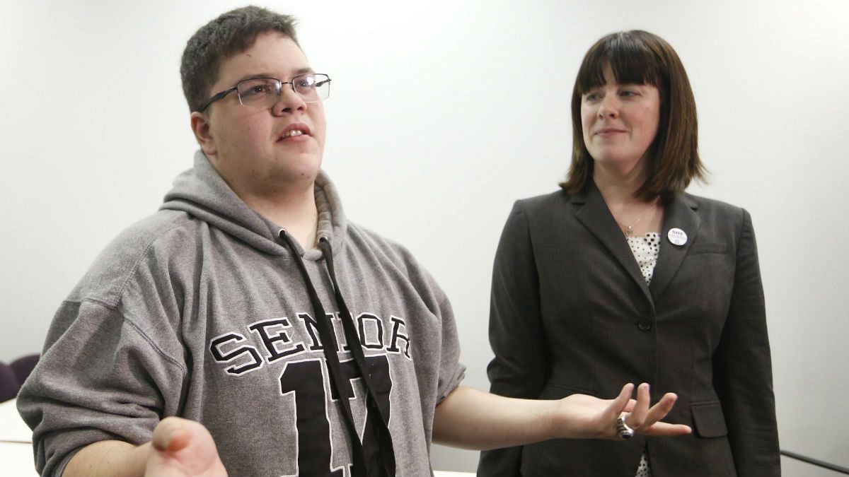 Gloucester County High School senior Gavin Grimm, a transgender student, left, speaks during a news conference as ACLU attorney Gail Deady