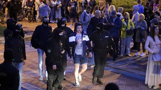 Police detain a protester during a Belarusian opposition supporters rally at Independence Square in Minsk.