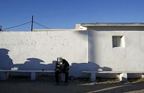 A man sat near south border of Phoenix with Mexico