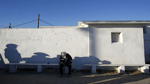 A man sat near south border of Phoenix with Mexico A man sat near south border of Phoenix with Mexico