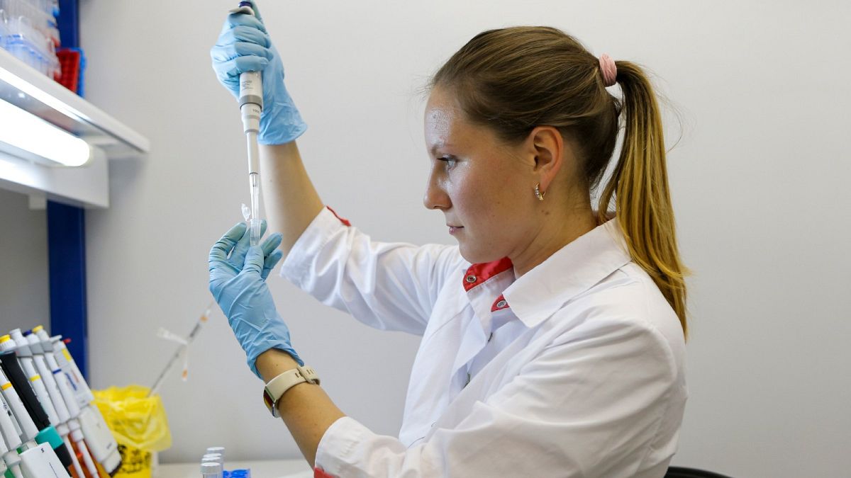 A researcher works with a coronavirus vaccine at the Nikolai Gamaleya National Center of Epidemiology and Microbiology in Moscow, Russia. Russia on Tuesday, Aug. 11