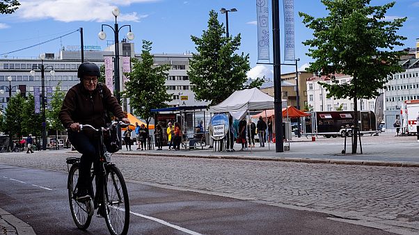 A cyclist rides past in Lathi, Finland, on August 24, 2020 A cyclist rides past in Lathi, Finland, on August 24, 2020