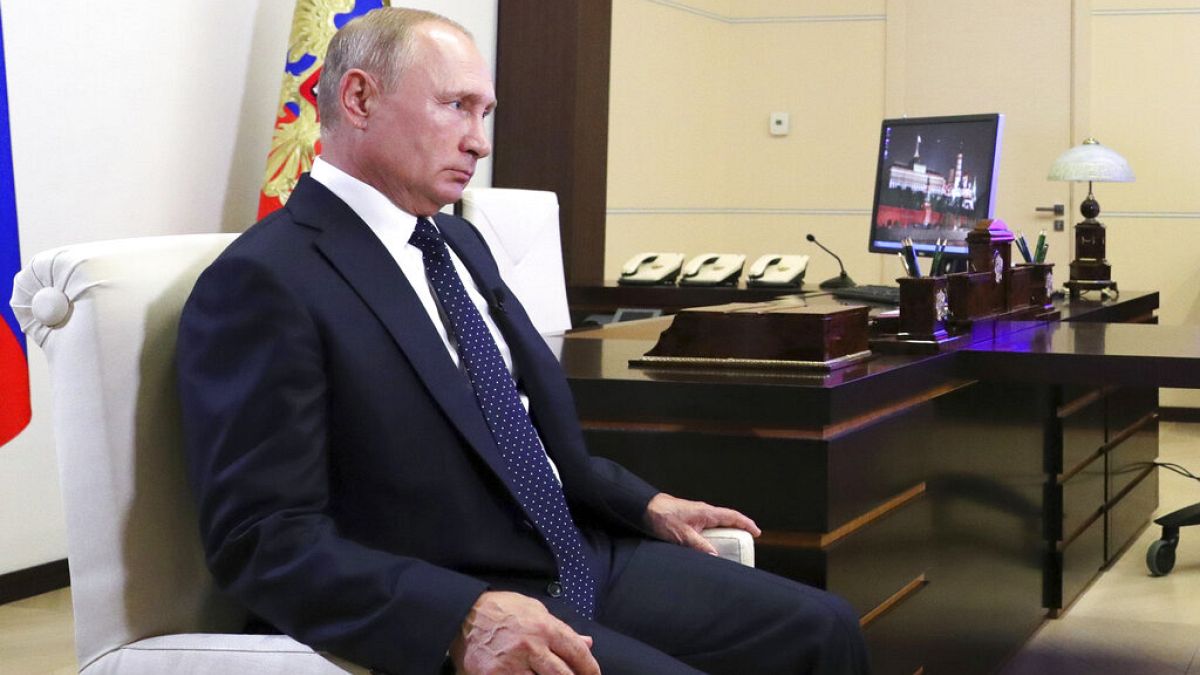 Russian President Vladimir Putin listens for a question during his interview with Russian journalist Deputy General Director of the TV channel "Russia" Sergei Brilev.