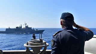 Photo provided by the Greek Defence Ministry, shows warships taking part in a military exercise in Eastern Mediterranean sea, Tuesday, Aug. 25, 2020.