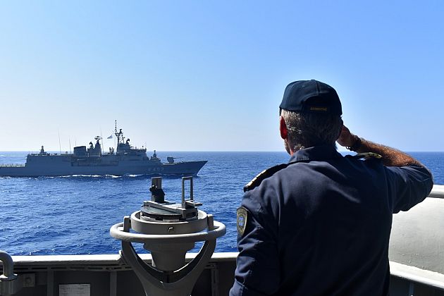 Photo provided by the Greek Defence Ministry, shows warships taking part in a military exercise in Eastern Mediterranean sea, Tuesday, Aug. 25, 2020. 