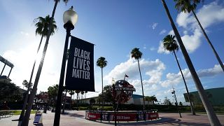 A Black Lives Matter banner outside the arena where NBA games have been postponed