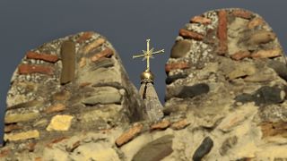 The cross on top of the Svetitskhoveli Orthodox cathedral in Mtskheta, Georgia