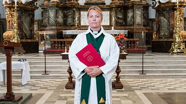 Priest Sandra Signarsdotter poses for a picture ahead of the Sunday service at Gustaf Vasa Church in Odenplan, Stockholm on August 23, 2020 Priest Sandra Signarsdotter poses for a picture ahead of the Sunday service at Gustaf Vasa Church in Odenplan, Stockholm on August 23, 2020
