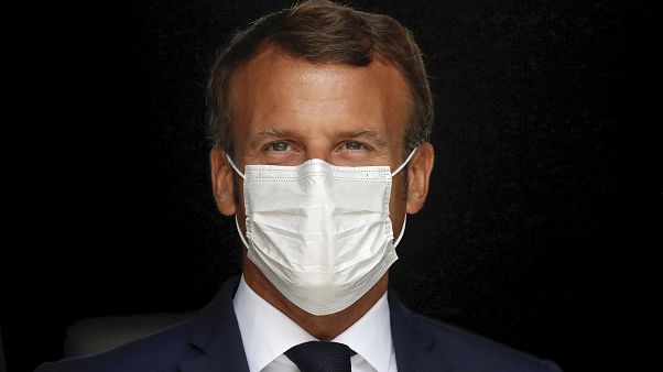 French President Emmanuel Macron, wearing a protective face mask, as he visits a site of pharmaceutical group Seqens, in Villeneuve-la-Garenne, near Paris, August 28, 2020. French President Emmanuel Macron, wearing a protective face mask, as he visits a site of pharmaceutical group Seqens, in Villeneuve-la-Garenne, near Paris, August 28, 2020.