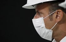 Emmanuel Macron wearing a protective mask in Villeneuve-la-Garenne, near Paris, Friday Aug. 28, 2020