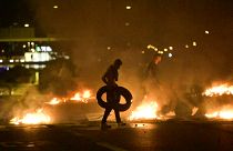 Demonstrators burn tyres during clashes with police in the Rosengard neighbourhood of Malmo, Sweden, on August 28, 2020