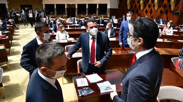 Zoran Zaev, the leader of the social democrats (SDSM), center, talks to the country's President Stevo Pendarovski, right, in parliament on Tuesday, Aug. 4, 2020 Zoran Zaev, the leader of the social democrats (SDSM), center, talks to the country's President Stevo Pendarovski, right, in parliament on Tuesday, Aug. 4, 2020