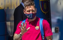  In this Aug. 13, 2020 file photo, Barcelona's Lionel Messi waves as he arrives at the team hotel in Lisbon, Portugal.