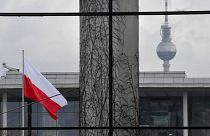 FILE - The Polish flag flies outside the German Chancellery in Berlin, 2018.
