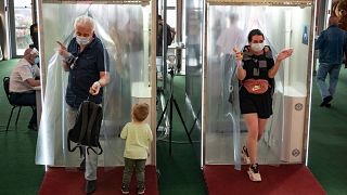 Passages equipped with disinfectant sprays at a shopping mall entrance in Moscow, Russia