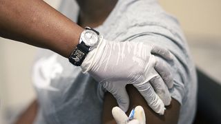 Sisi Ndebele, receives a seasonal influenza vaccine from a nurse at a local pharmacy clinic in Johannesburg, South Africa on Friday, April 24, 2020.