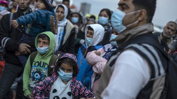 Refugees and migrants wearing masks to prevent the spread off the coronavirus, after their arrival at the port of Piraeus , near Athens, on May 4, 2020. Refugees and migrants wearing masks to prevent the spread off the coronavirus, after their arrival at the port of Piraeus , near Athens, on May 4, 2020.
