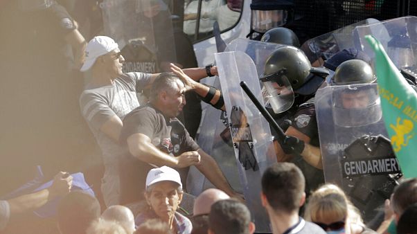 Police scuffle with protesters during rally in front of the new National Assembly building, demanding government resignation in Sofia on Wednesday, Sept. 2, 2020. Police scuffle with protesters during rally in front of the new National Assembly building, demanding government resignation in Sofia on Wednesday, Sept. 2, 2020.