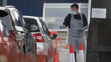 Staff work at a the COVID-19 testing facility at Ikea near the Wembley stadium in London, Wednesday, April 29, 2020. 