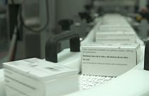 Medication labels are added on a production line before being shipped to European pharmacies.