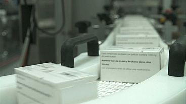 Medication labels are added on a production line before being shipped to European pharmacies. 
