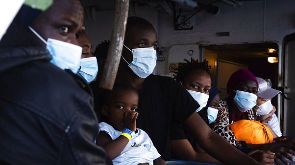 Some of the 353 migrants rescued by Sea-Watch 4 wait to board the quarantine Ferry Gnv Allegra, in front of the port of Palermo, Italy. Some of the 353 migrants rescued by Sea-Watch 4 wait to board the quarantine Ferry Gnv Allegra, in front of the port of Palermo, Italy.
