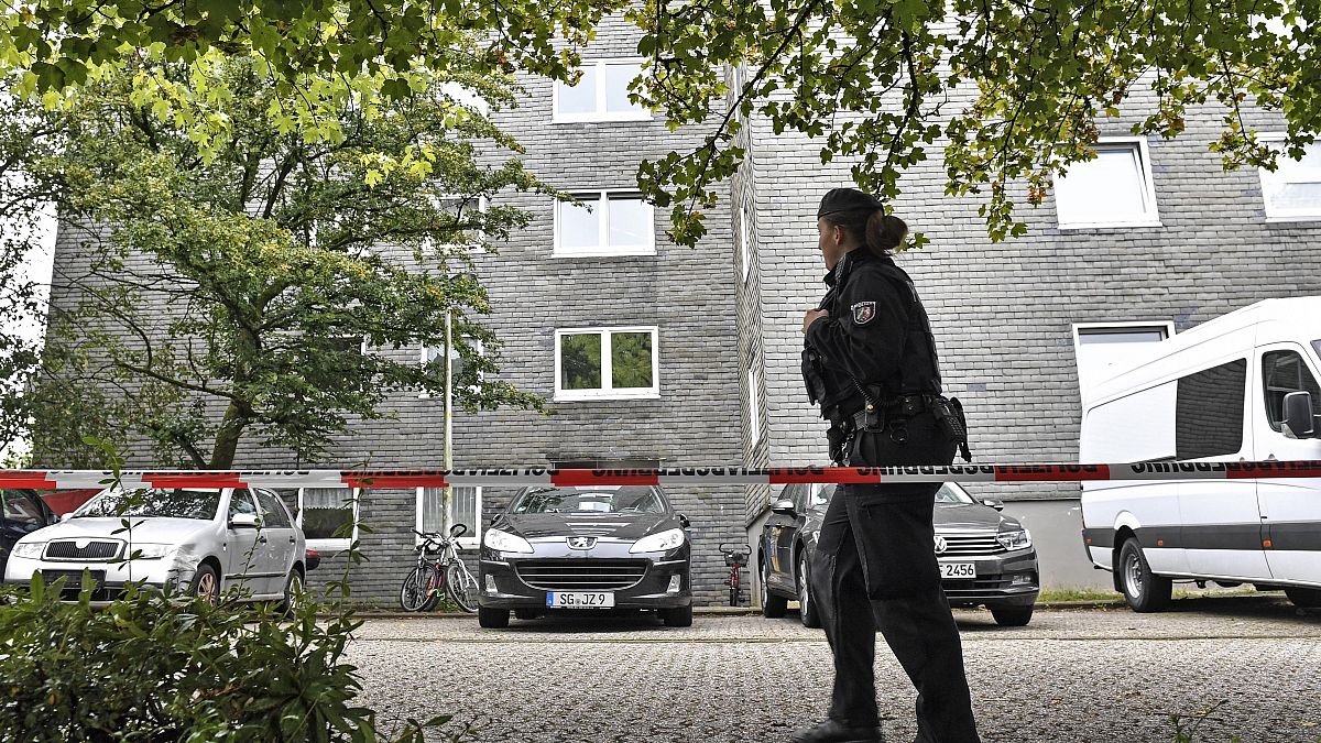 Police secure a house where five dead children were found in Solingen, Germany, Thursday, Sept. 3, 2020.