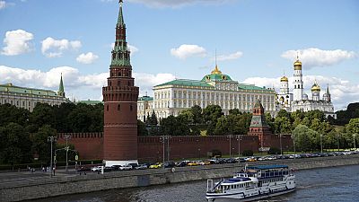 A tourist boat passes the Kremlin in Moscow, Russia.