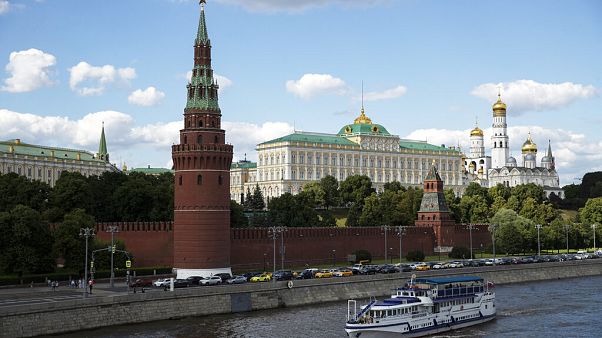 A tourist boat passes the Kremlin in Moscow, Russia. A tourist boat passes the Kremlin in Moscow, Russia.