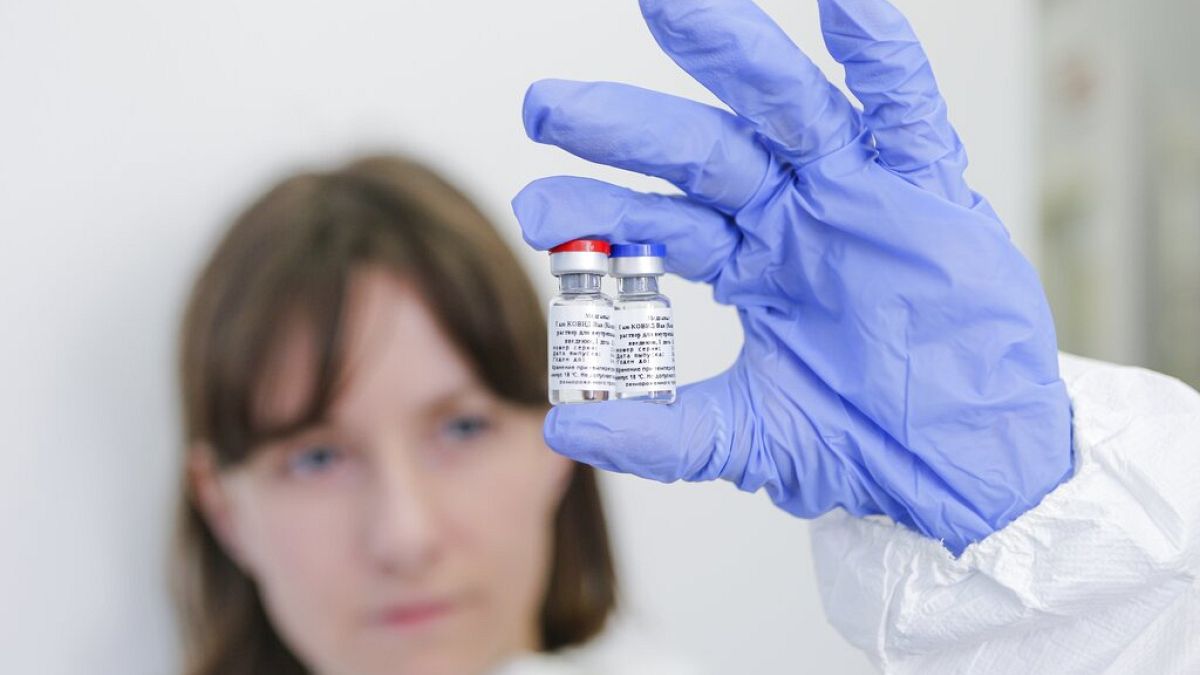 Russia Aug. 6, 2020, and provided by Russian Direct Investment Fund, an employee shows a new vaccine at the Nikolai Gamaleya National Center of Epidemiology and Microbiology