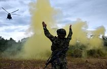 A soldier in Colombia working to catch those responsible for illegal deforestation.