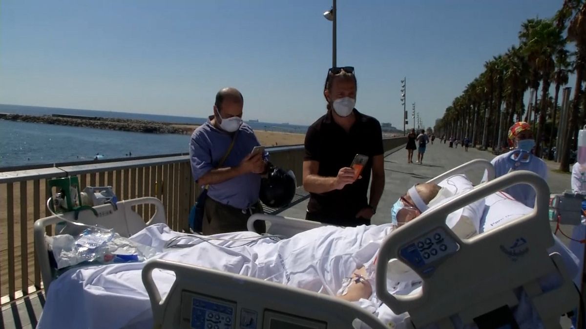 After months in ICU, a patient takes in the sea view in Barcelona