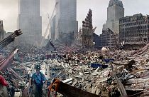 Rescue workers examine the site of the Sept. 11, 2001 World Trade Center terrorist attacks in New York