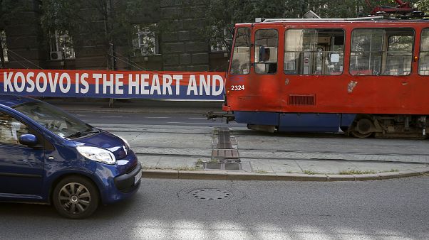 A tram car passes by a billboard reading: ''Kosovo is the heart and soul of Serbia'' placed on a street in front of the government building in Belgrade, Serbia, Sept. 2, 2020. A tram car passes by a billboard reading: ''Kosovo is the heart and soul of Serbia'' placed on a street in front of the government building in Belgrade, Serbia, Sept. 2, 2020.