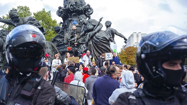 A few hundred people gather during an anti-mask demonstration in Paris on August 29 A few hundred people gather during an anti-mask demonstration in Paris on August 29