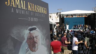 FILE - A picture of slain Saudi journalist Jamal Kashoggi, is displayed during a ceremony near the Saudi Arabia consulate in Istanbul, marking one year since his death.