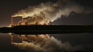 FILE - In this Wednesday, Nov. 28, 2018 file photo, plumes of smoke rise from Europe's largest lignite power plant in Belchatow, central Poland.