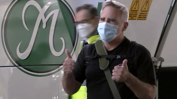 In this image made from a video, The Australian Financial Review journalist Michael Smith on his arrival at Sydney airport, Australia Tuesday, Sept. 8, 2020. In this image made from a video, The Australian Financial Review journalist Michael Smith on his arrival at Sydney airport, Australia Tuesday, Sept. 8, 2020.