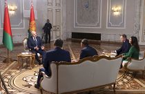 Belarusian President Alexander Lukashenko, left, speaks during his interview with Russian journalists in Minsk, Belarus, Sept. 8, 2020. (Nikolai Petrov, BelTA via AP)