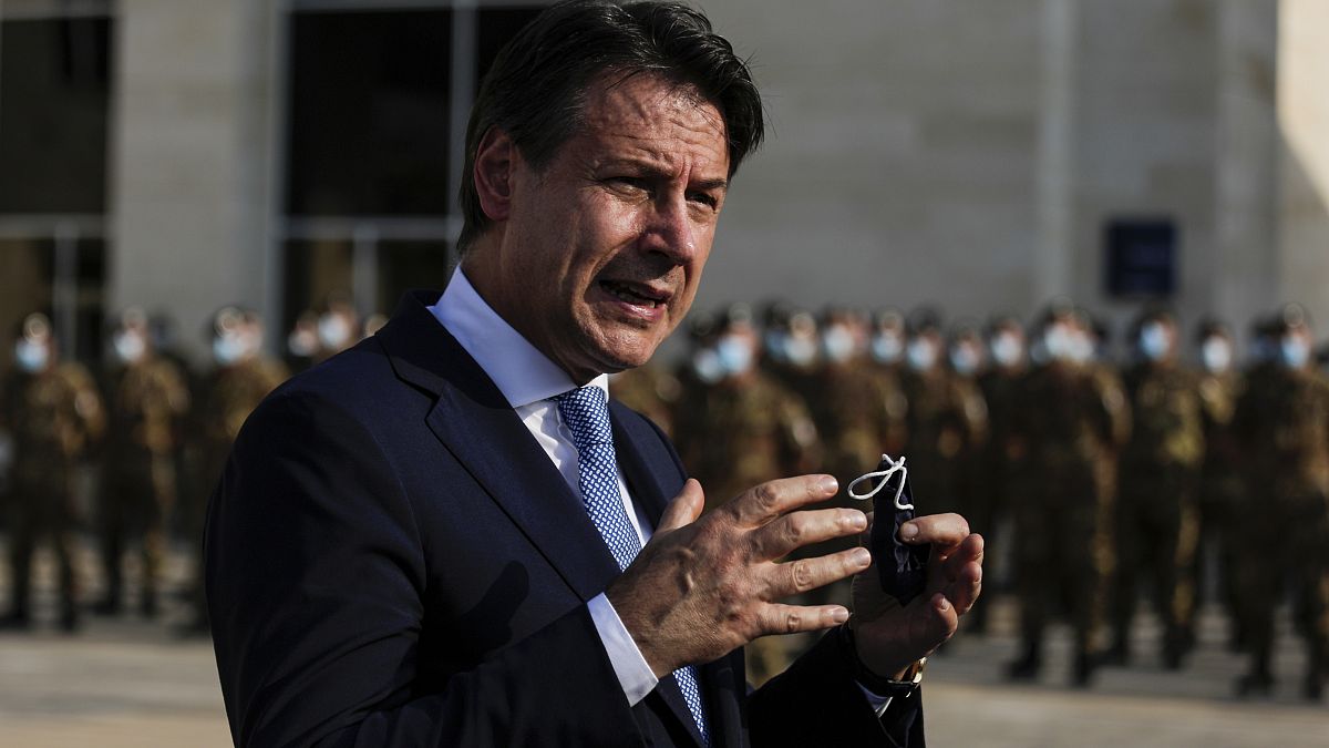 Italian Prime Minister Giuseppe Conte speaks to journalists as he visits an Italian field hospital set up at the Lebanese University in the Hadath district of Beirut, Lebanon,
