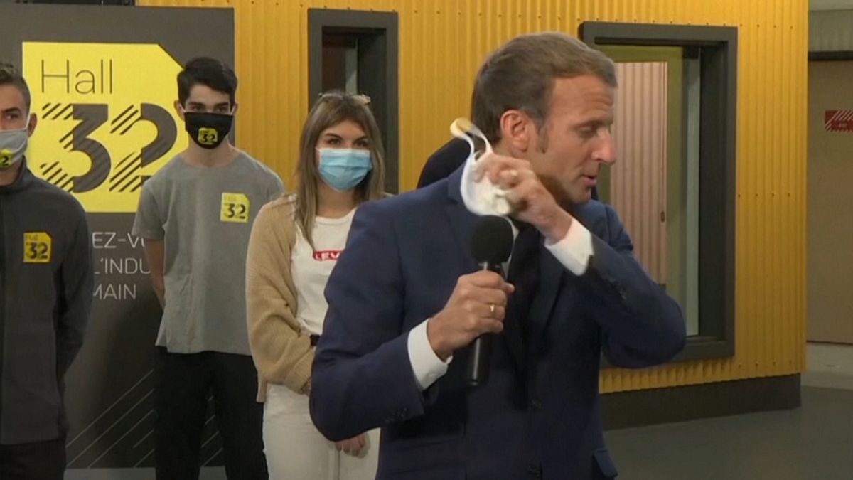 French President Emmanuel Macron coughs while speaking to students in Clermont-Ferrand. September 9, 2020.