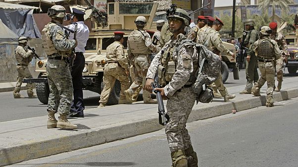 Irak'ın başkenti Bağdat'taki Amerikan askerleri (arşiv) Irak'ın başkenti Bağdat'taki Amerikan askerleri (arşiv)