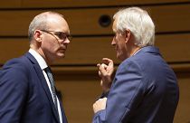 European Union chief Brexit negotiator Michel Barnier, right, speaks with Irish Foreign Minister Simon Coveney, left, during meeting of EU General Affairs ministers, Oct 2019