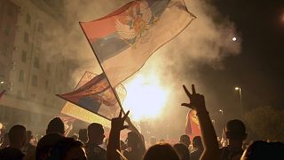 Pro-opposition supporters celebrate the election results in Podgorica, Montenegro, early in the morning on August 31, 2020.