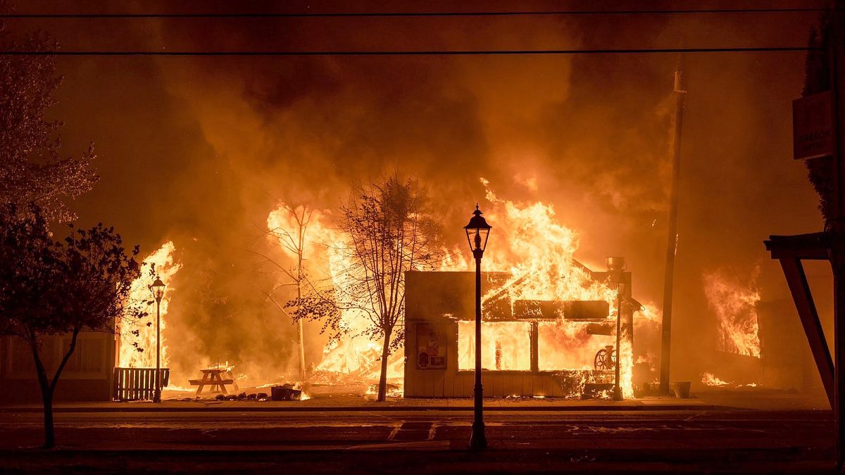 Buildings are engulfed in flames as a wildfire ravages the Oregon town of Talent on September 8, 2020.