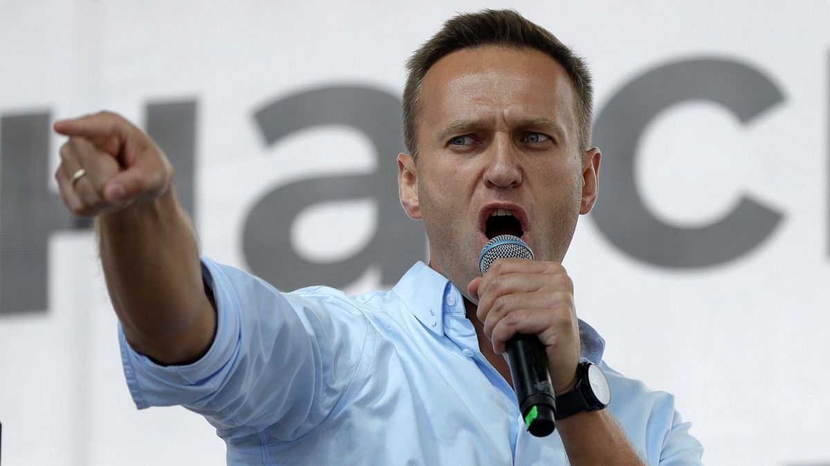 Russian opposition activist Alexei Navalny gestures while speaking to a crowd during a political protest in Moscow.